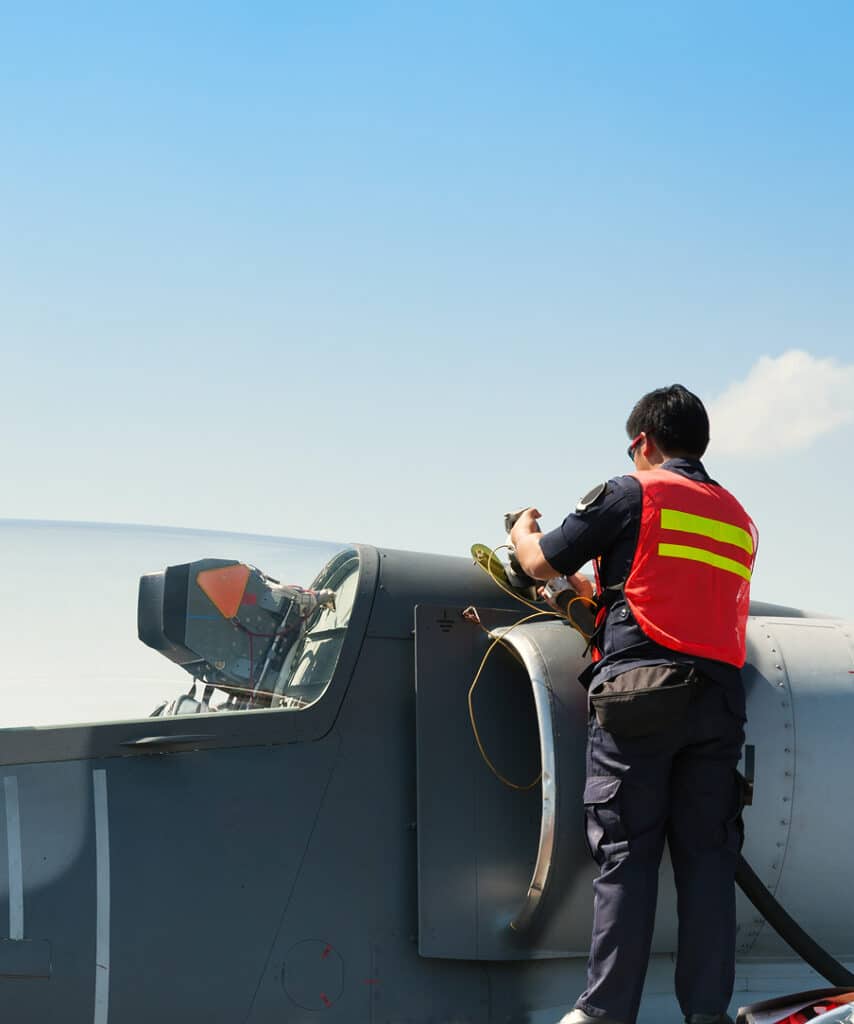 A person working on aircraft