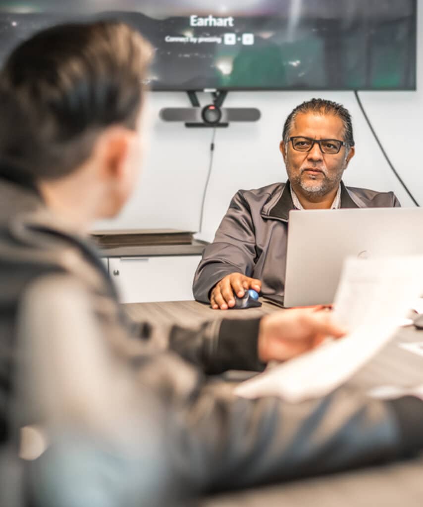 People working around a conference room table